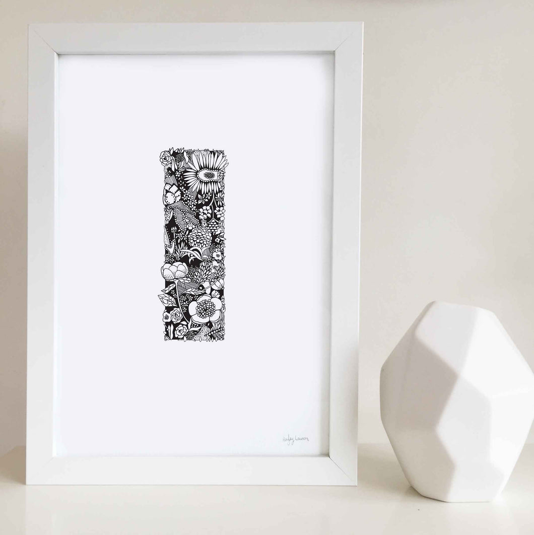 The floral letter 'I' artwork was illustrated by Hayley Lauren in Melbourne, Australia. It is the perfect artwork to personalise a nursery or kids bedroom.
