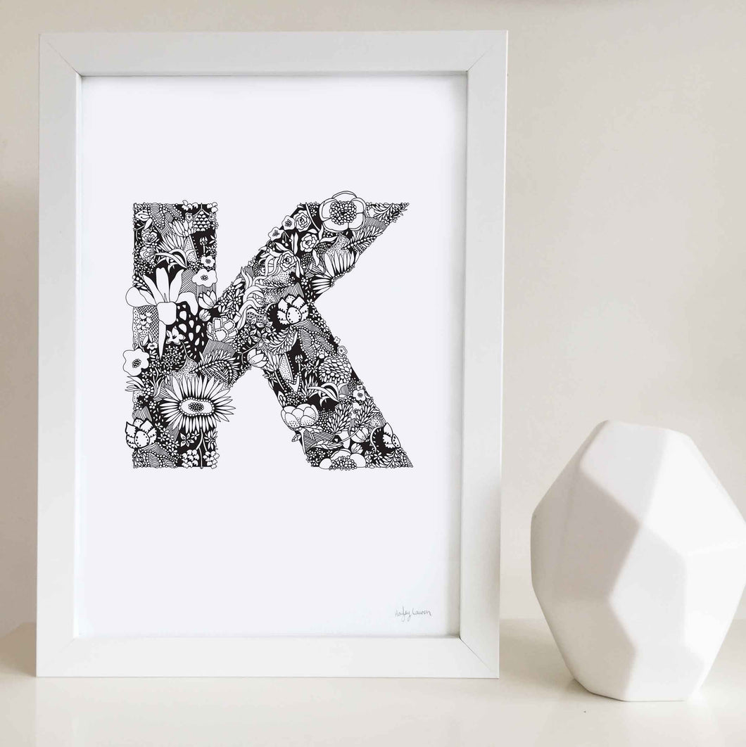The floral letter 'K' artwork was illustrated by Hayley Lauren in Melbourne, Australia. It is the perfect artwork to personalise a nursery or kids bedroom.