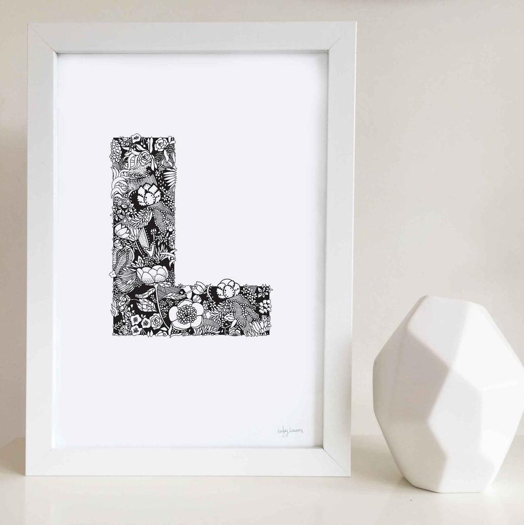 The floral letter 'L' artwork was illustrated by Hayley Lauren in Melbourne, Australia. It is the perfect artwork to personalise a nursery or kids bedroom.