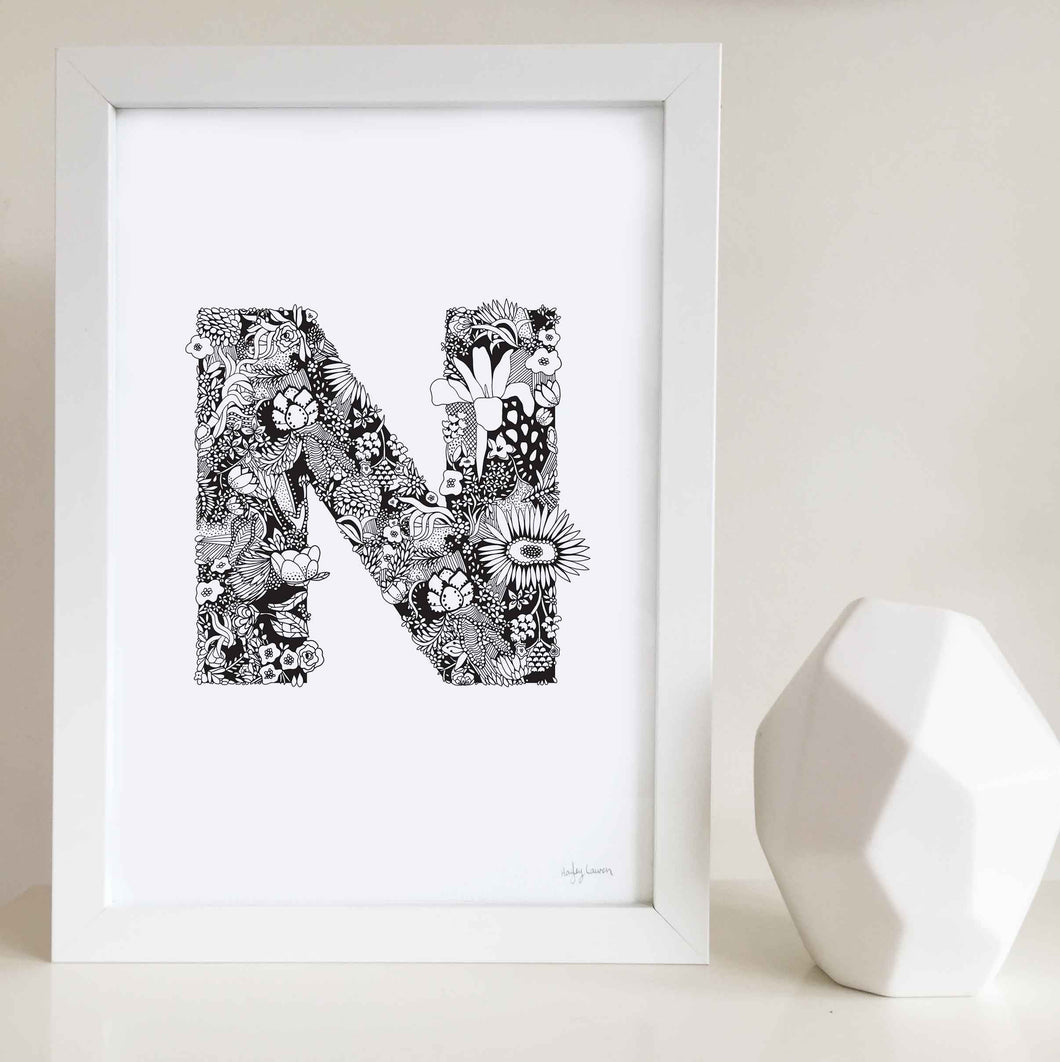 The floral letter 'N' artwork was illustrated by Hayley Lauren in Melbourne, Australia. It is the perfect artwork to personalise a nursery or kids bedroom.