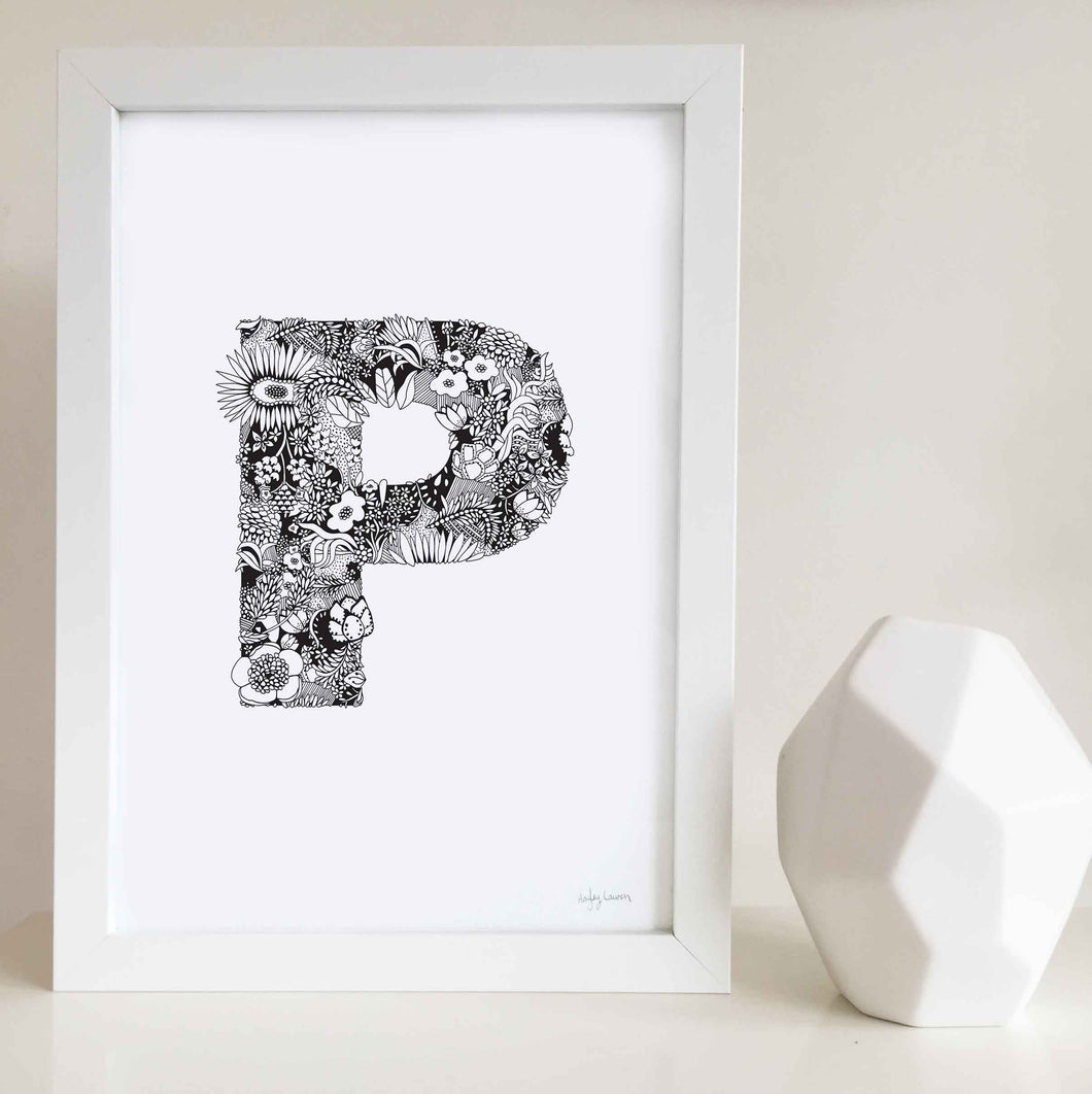 The floral letter 'P' artwork was illustrated by Hayley Lauren in Melbourne, Australia. It is the perfect artwork to personalise a nursery or kids bedroom.