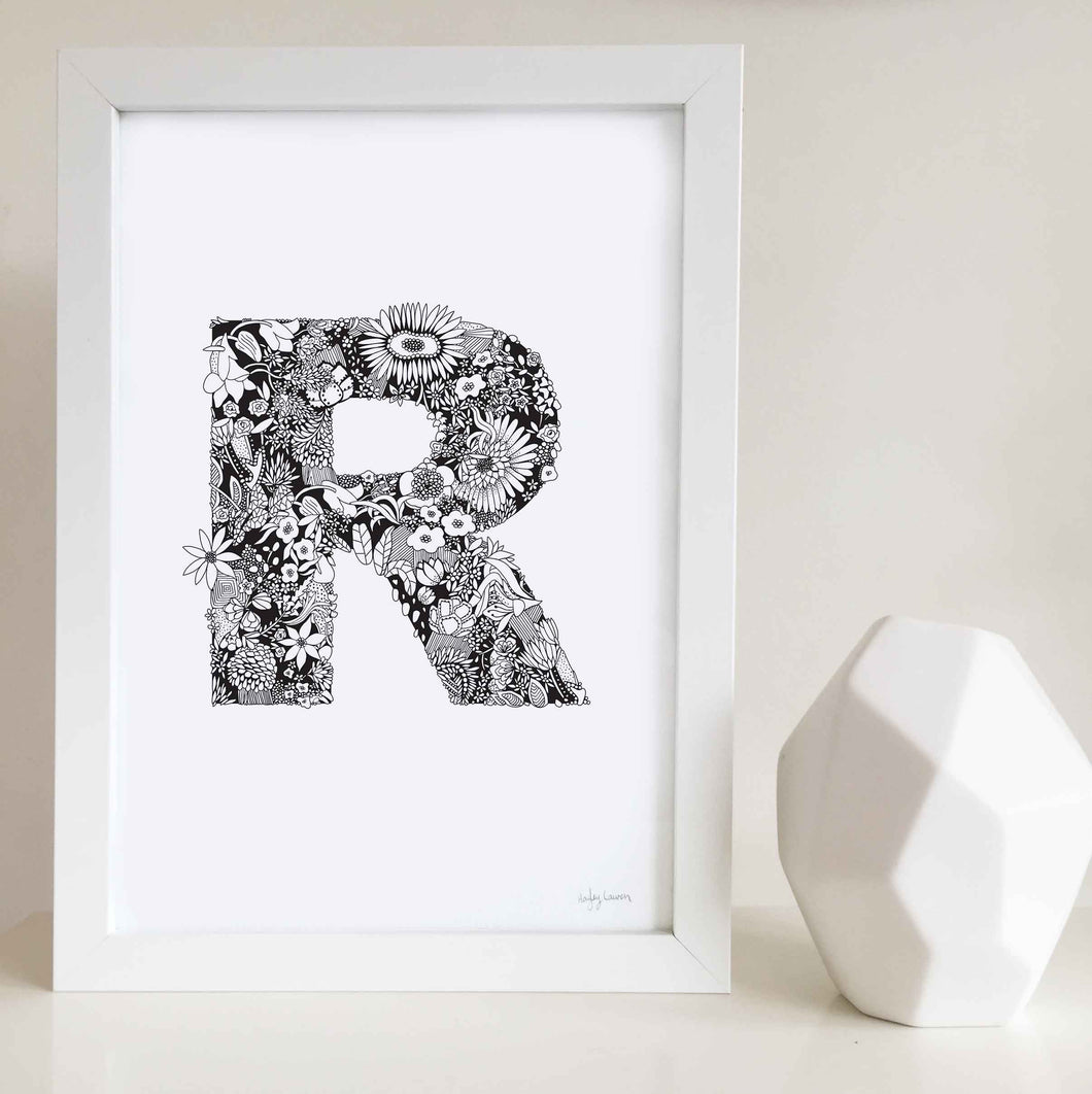 The floral letter 'R' artwork was illustrated by Hayley Lauren in Melbourne, Australia. It is the perfect artwork to personalise a nursery or kids bedroom.