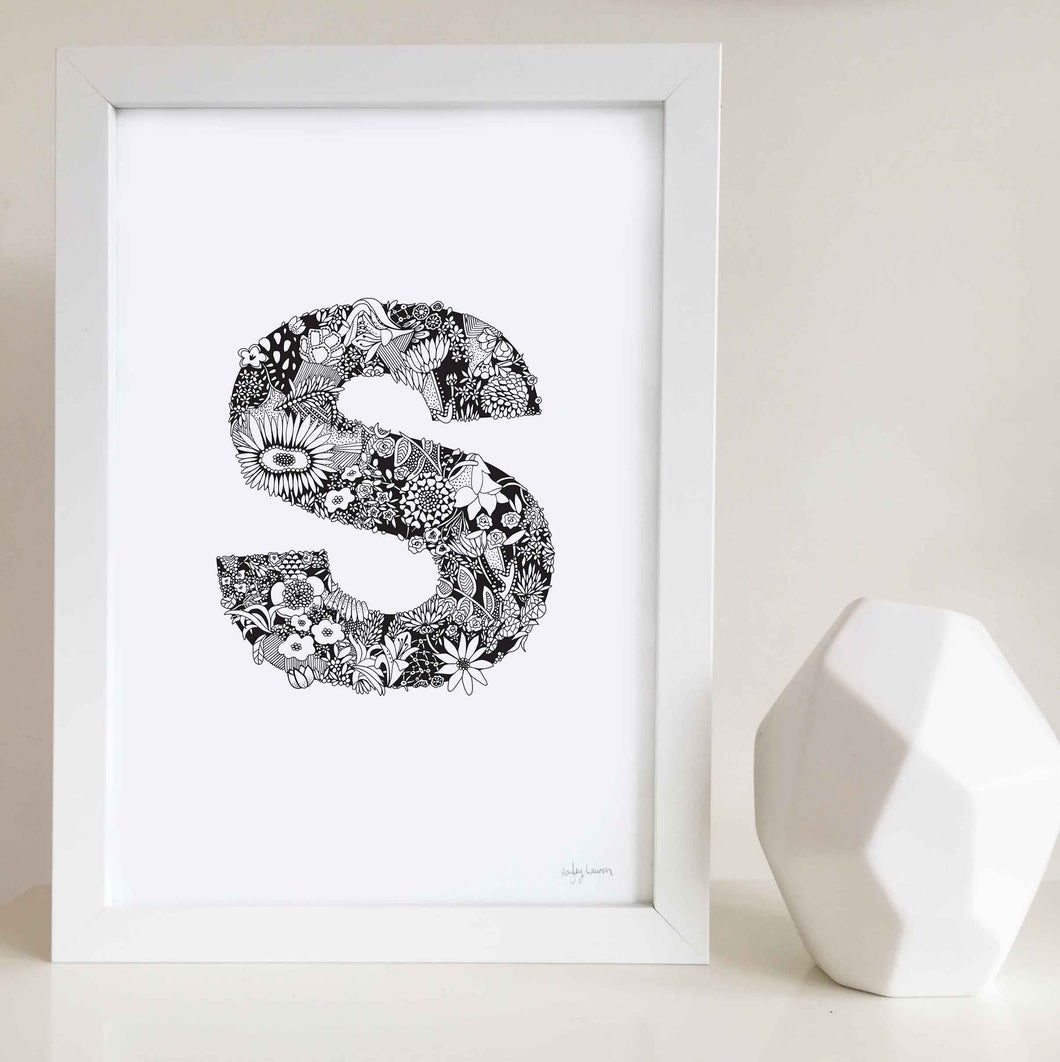 The floral letter 'S' artwork was illustrated by Hayley Lauren in Melbourne, Australia. It is the perfect artwork to personalise a nursery or kids bedroom.