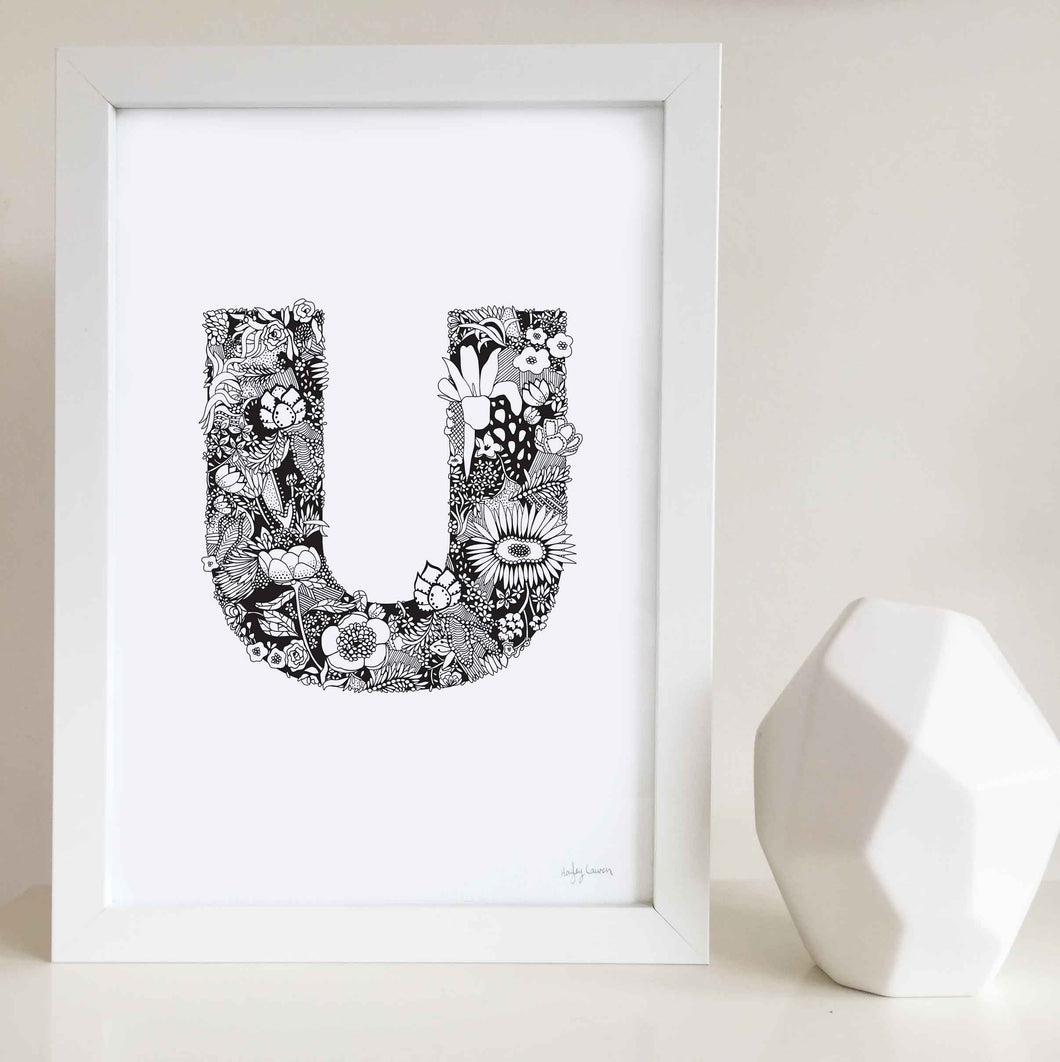 The floral letter 'U' artwork was illustrated by Hayley Lauren in Melbourne, Australia. It is the perfect artwork to personalise a nursery or kids bedroom.