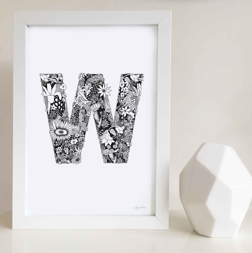 The floral letter 'W' artwork was illustrated by Hayley Lauren in Melbourne, Australia. It is the perfect artwork to personalise a nursery or kids bedroom.
