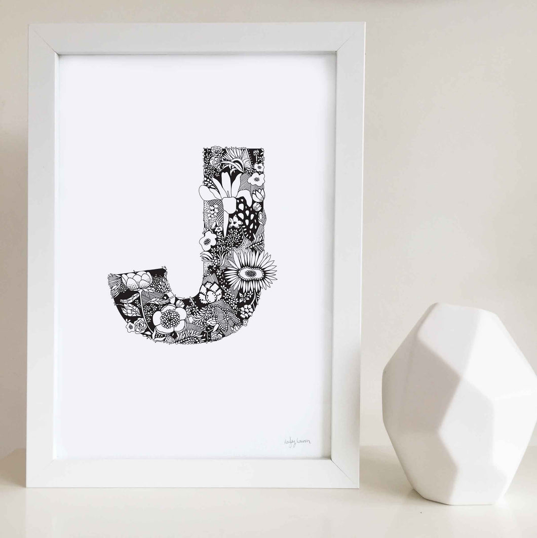 The floral letter 'J' artwork was illustrated by Hayley Lauren in Melbourne, Australia. It is the perfect artwork to personalise a nursery or kids bedroom whose name starts with the letter J. Jessica, Joanna, Jade, Jasmine, Jenna