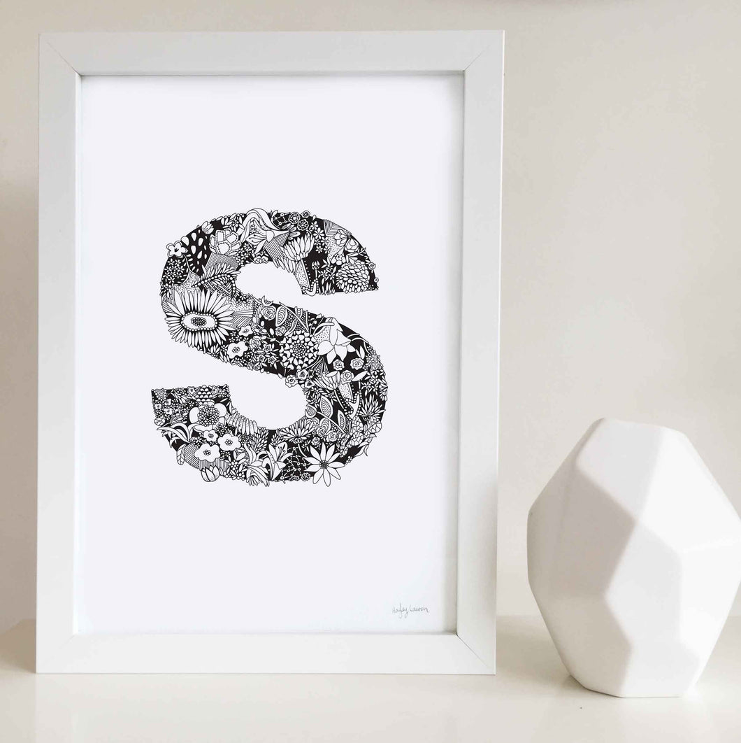 The floral letter 'S' artwork was illustrated by Hayley Lauren in Melbourne, Australia. It is the perfect artwork to personalise a nursery or kids bedroom. 