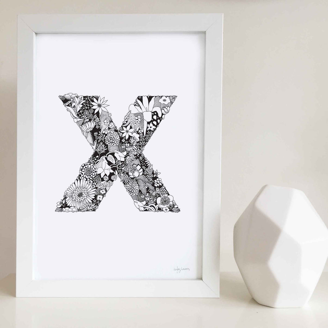 The floral letter 'X' artwork was illustrated by Hayley Lauren in Melbourne, Australia. It is the perfect artwork to personalise a nursery or kids bedroom. 